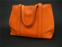 橘色荔枝纹单肩手提包