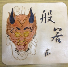皮雕般若手拿包